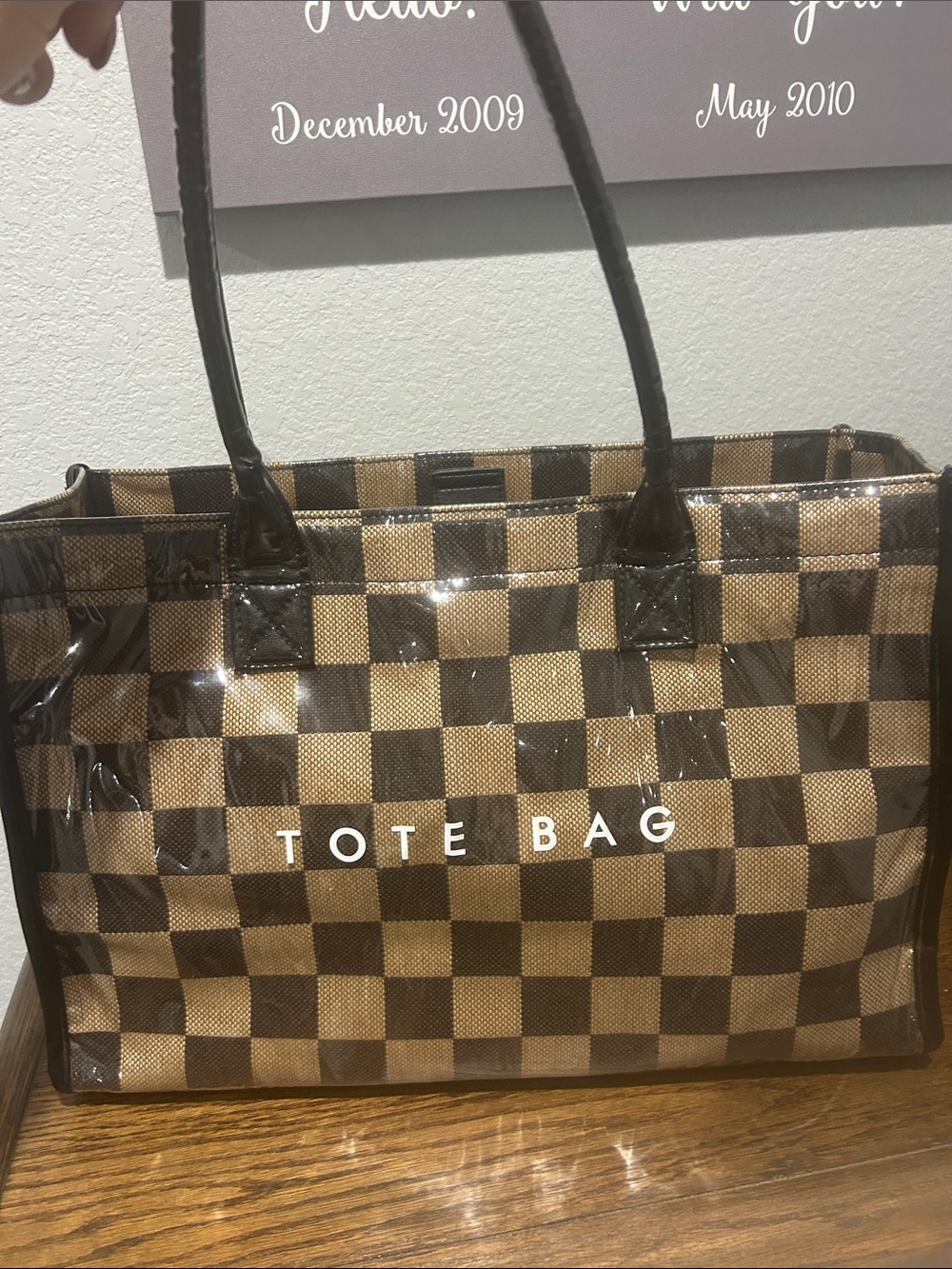 “Fake” large tote bag. With plastic outside and material inside.